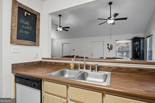 a kitchen with a sink and cabinets