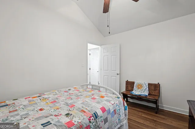 a bedroom with a bed and a dresser in it