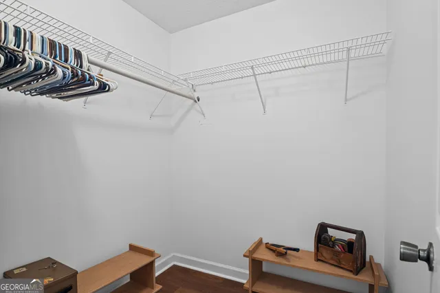 a view of a house with wooden fence