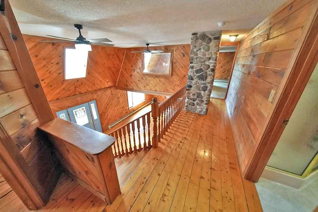 808 Skedgell Road Orient, ME 04471 - Photo 17 of 100 hall-balcony-808-skedgell