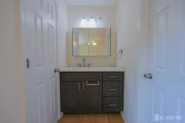 a bathroom with a sink and a mirror