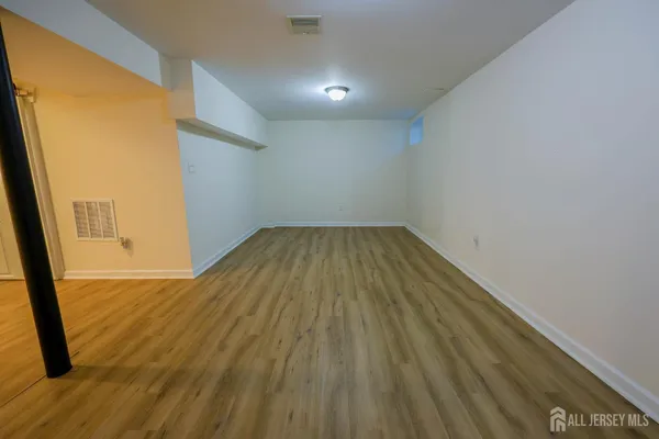 a view of wooden floor in an empty room