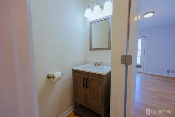 a bathroom with a sink and mirror
