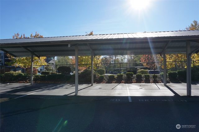a view of a patio with table and chairs