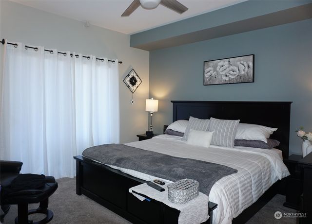 a bedroom with a bed and a furniture