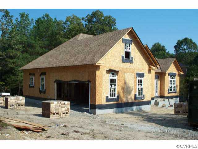12909 Chipstead Road Chester, VA 23831 - Photo 2 of 4 a front view of a house with a yard