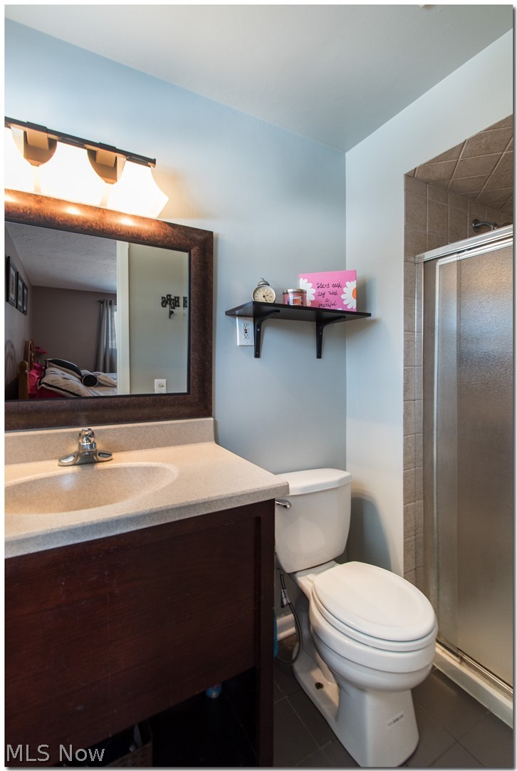 6546 Hansford Road Cleveland, OH 44124 - Photo 17 of 29 Master Bathroom has new toilet and light/mirror.