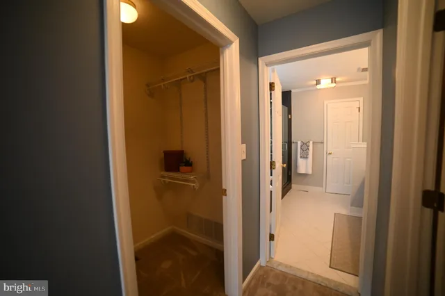 a view of a bathroom from a hallway