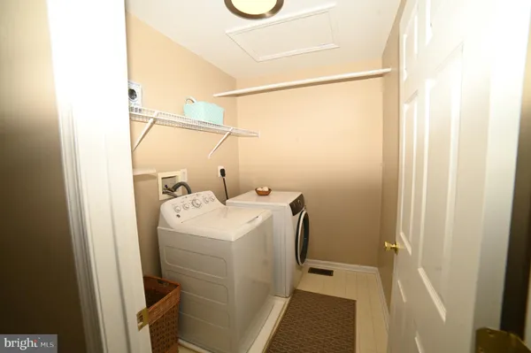 a view of an empty room with glass door