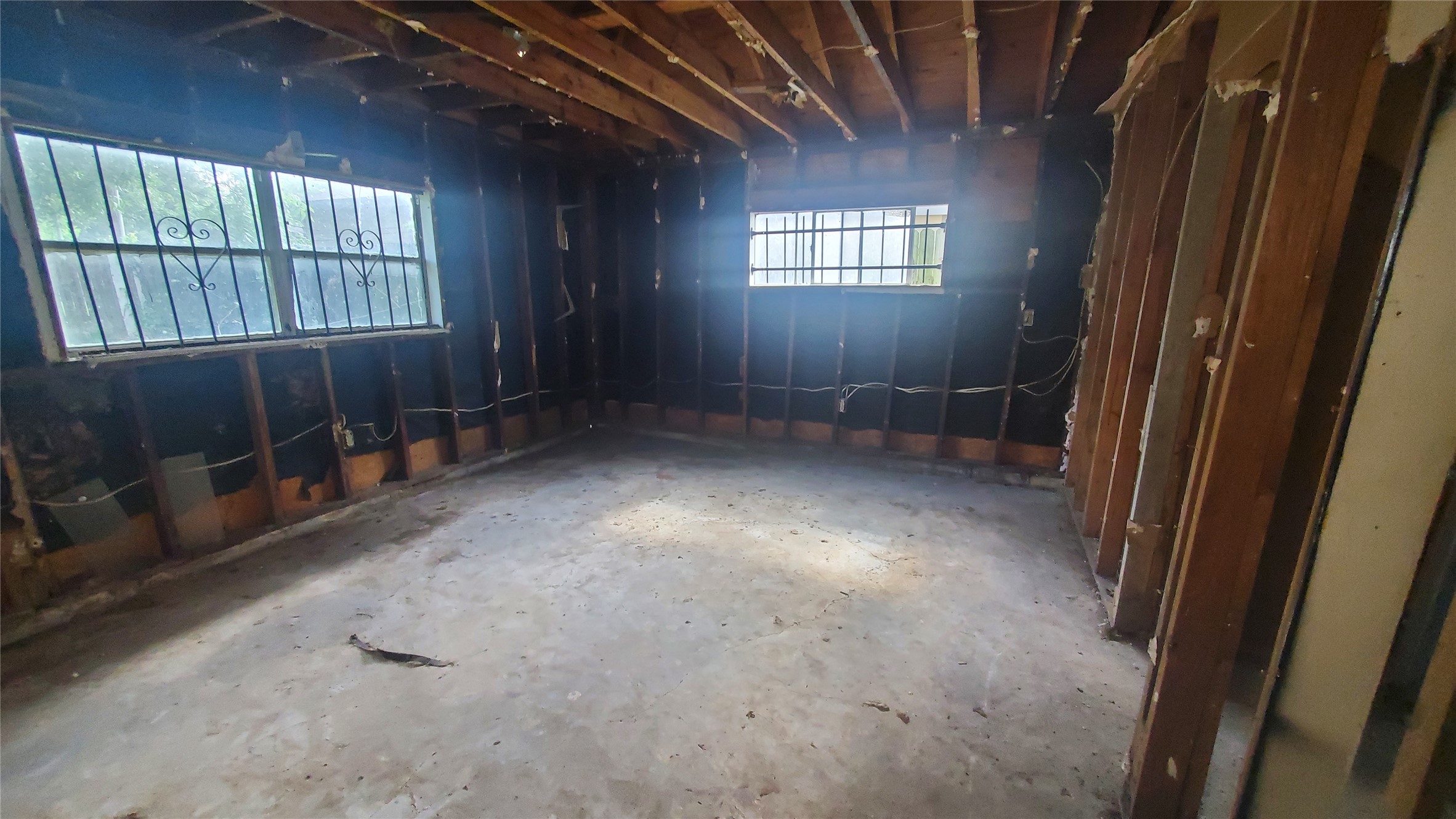 4821 Burma Road Houston, TX 77033 - Photo 11 of 23 a view of an empty room with windows
