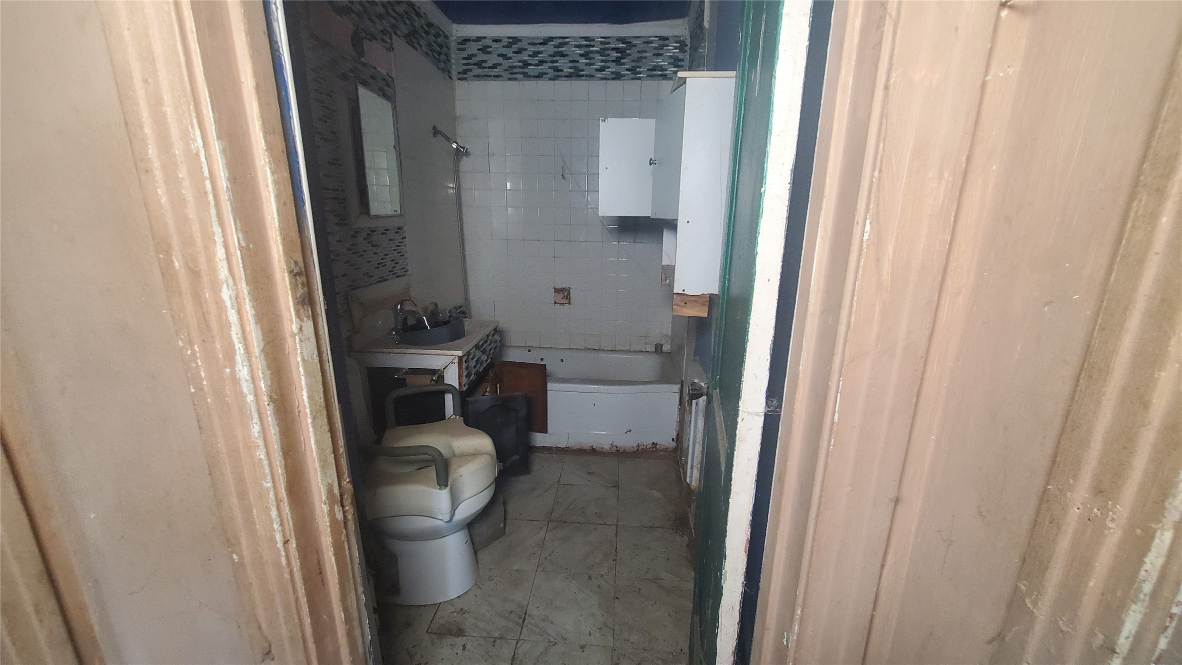 4821 Burma Road Houston, TX 77033 - Photo 17 of 23 a bathroom with a toilet and a shower