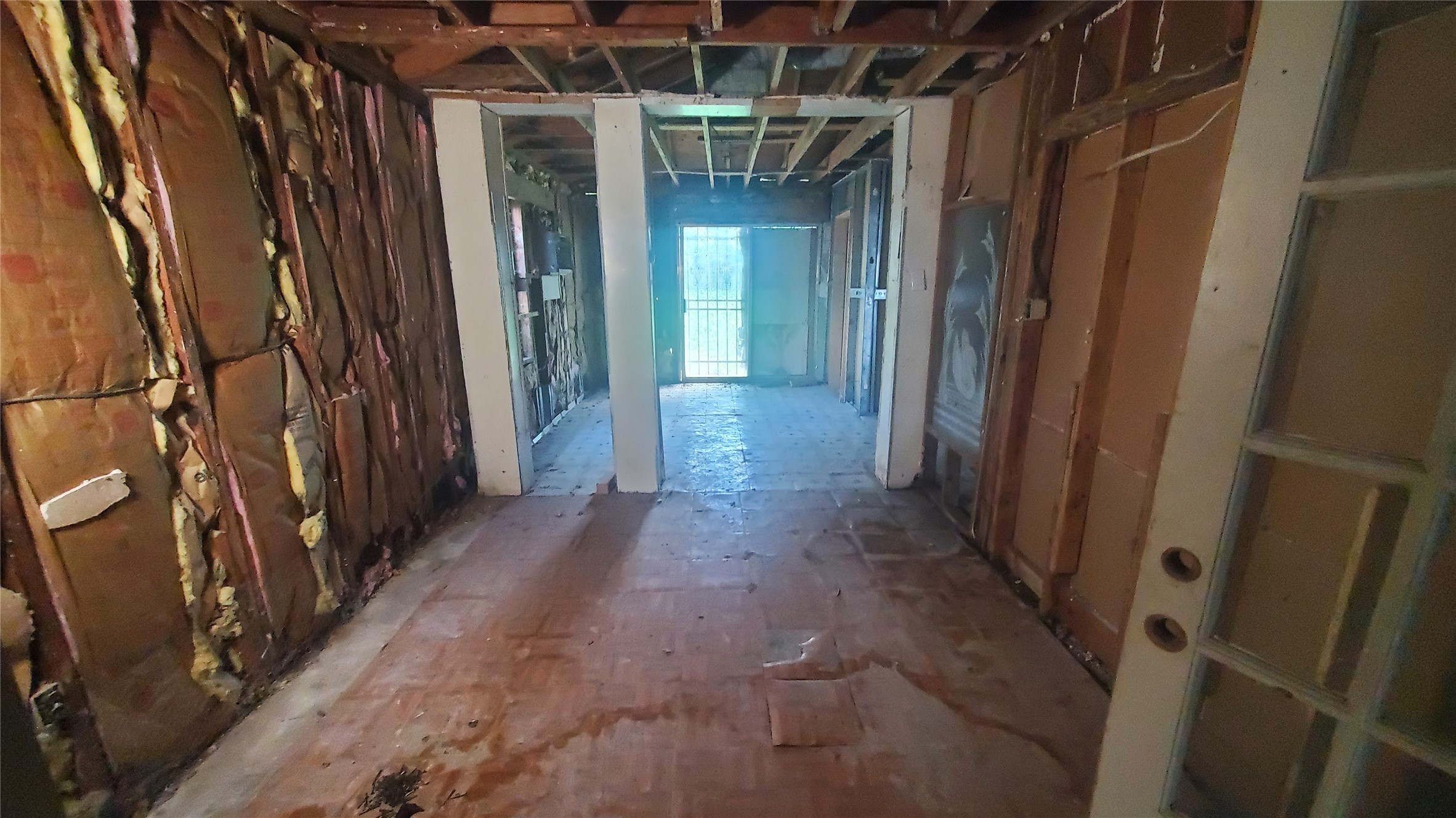 4821 Burma Road Houston, TX 77033 - Photo 6 of 23 a view of a hallway with wooden walls
