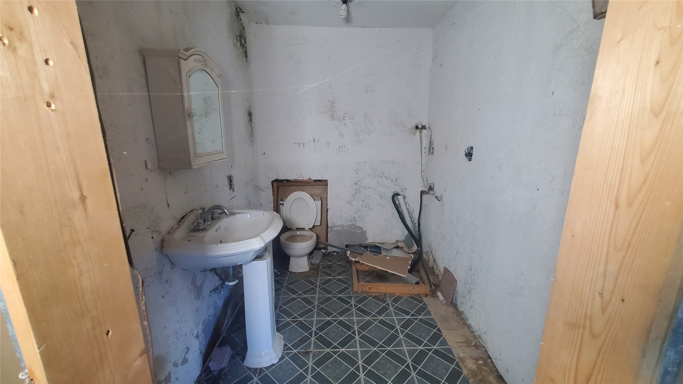 4821 Burma Road Houston, TX 77033 - Photo 8 of 23 a bathroom with a sink and toilet