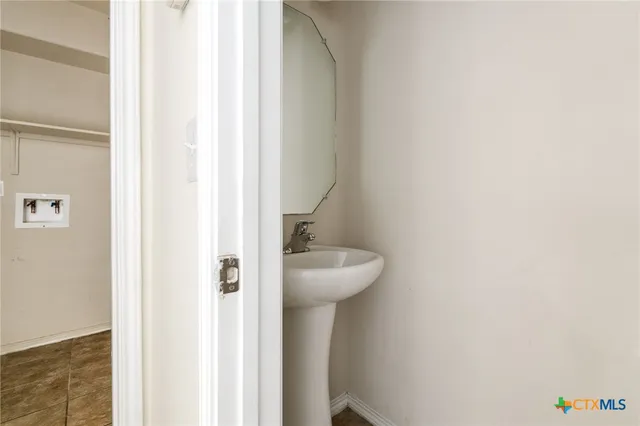 a bathroom with a sink and toilet