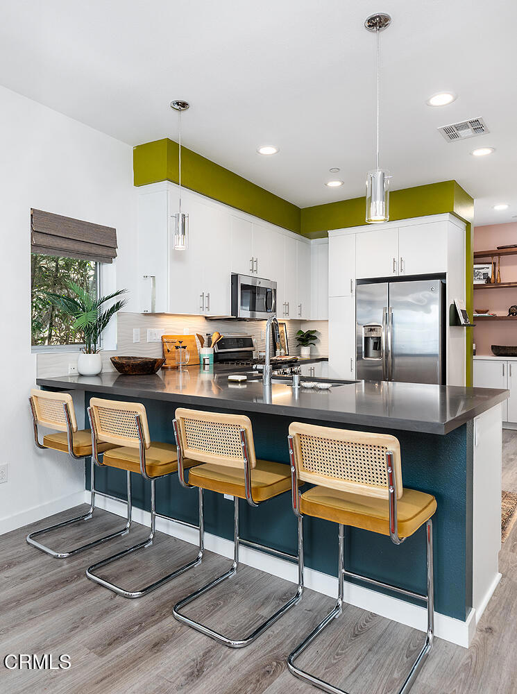 2222 Strata Lane Los Angeles, CA 90041 - Photo 11 of 31 a living room with kitchen furniture kitchen view and a wooden floor