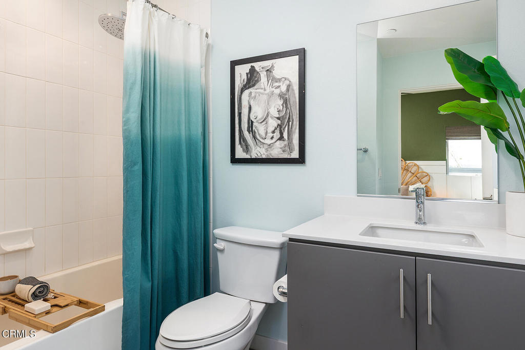 2222 Strata Lane Los Angeles, CA 90041 - Photo 23 of 31 a bathroom with a toilet sink and mirror