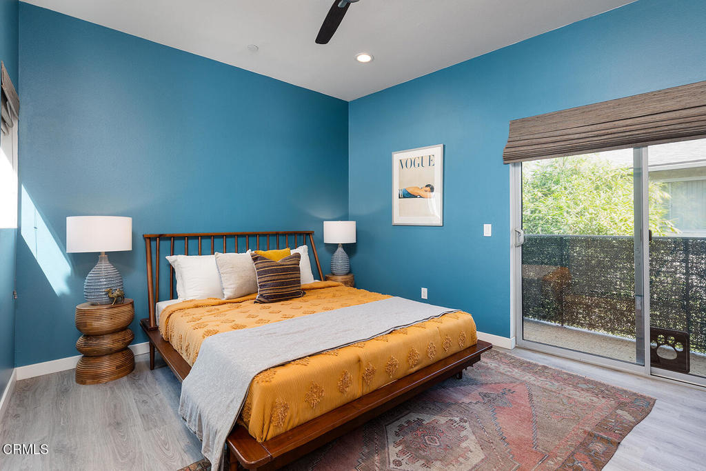 2222 Strata Lane Los Angeles, CA 90041 - Photo 24 of 31 a bedroom with a bed and wooden floor