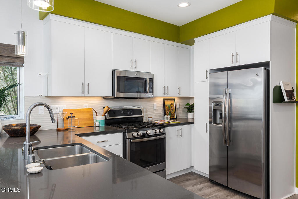 2222 Strata Lane Los Angeles, CA 90041 - Photo 9 of 31 a kitchen with granite countertop a refrigerator and a sink