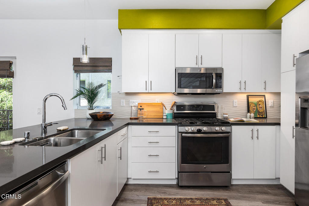 2222 Strata Lane Los Angeles, CA 90041 - Photo 10 of 31 a kitchen with stainless steel appliances a stove a sink and a microwave