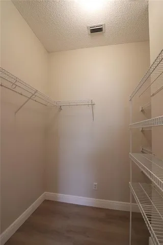 a view of a room with racks on the wall