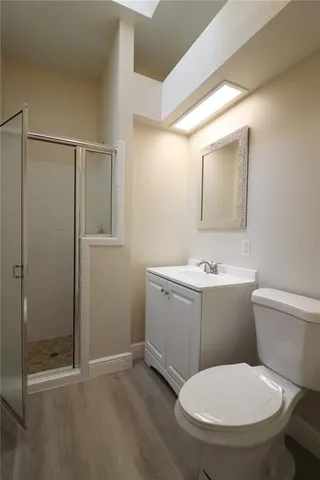 a bathroom with a toilet sink and shower