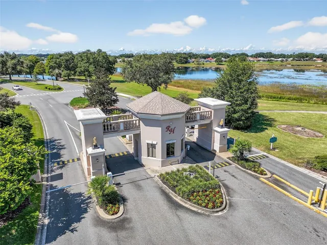 an aerial view of a house with outdoor space swimming pool and lake view