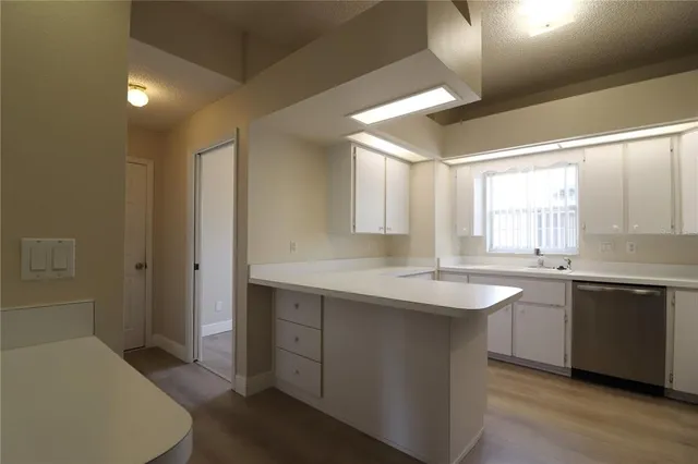 a kitchen with center island and sink