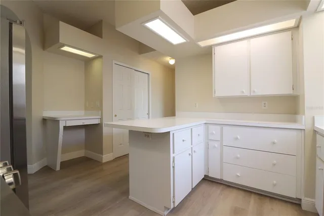 a view of cabinets and wooden floor