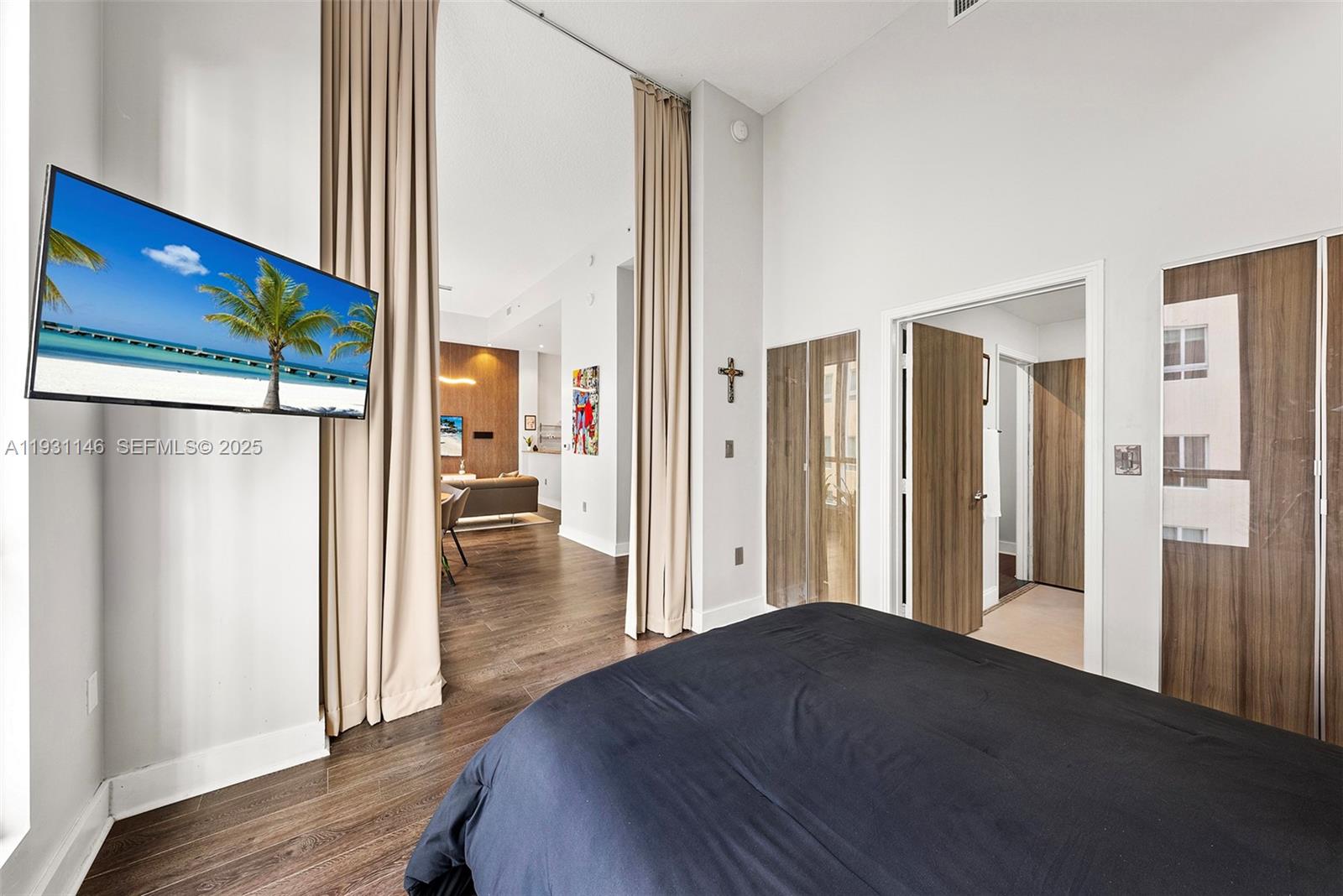 9066 Southwest 73rd Court, Unit 405 Miami, FL 33156 - Photo 13 of 32 a view of a hallway with wooden floor and a cabinet