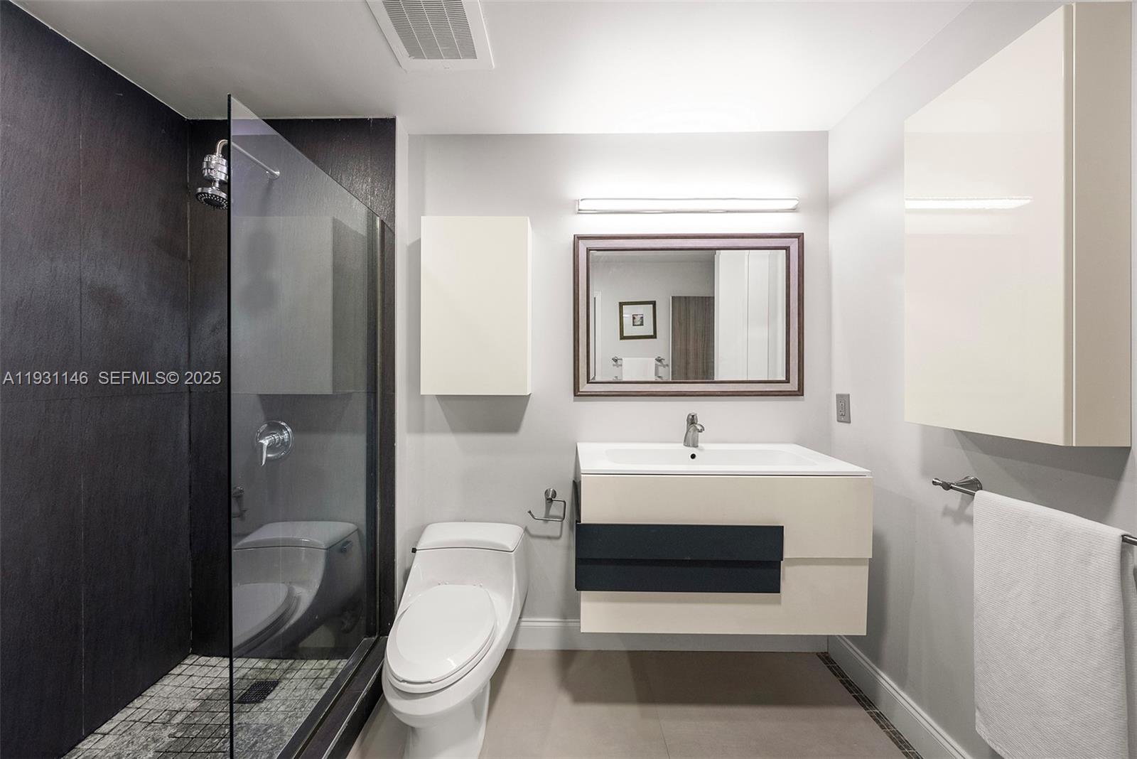 9066 Southwest 73rd Court, Unit 405 Miami, FL 33156 - Photo 16 of 32 a bathroom with a sink toilet and shower