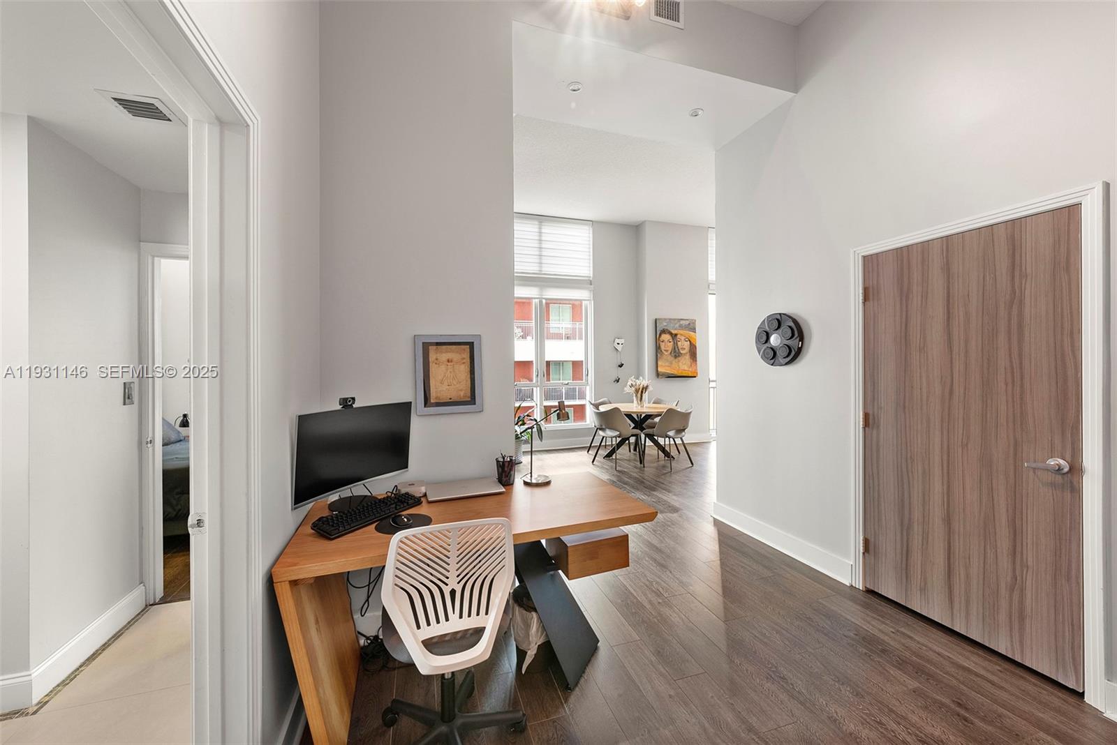9066 Southwest 73rd Court, Unit 405 Miami, FL 33156 - Photo 20 of 32 a living room with furniture and a flat screen tv