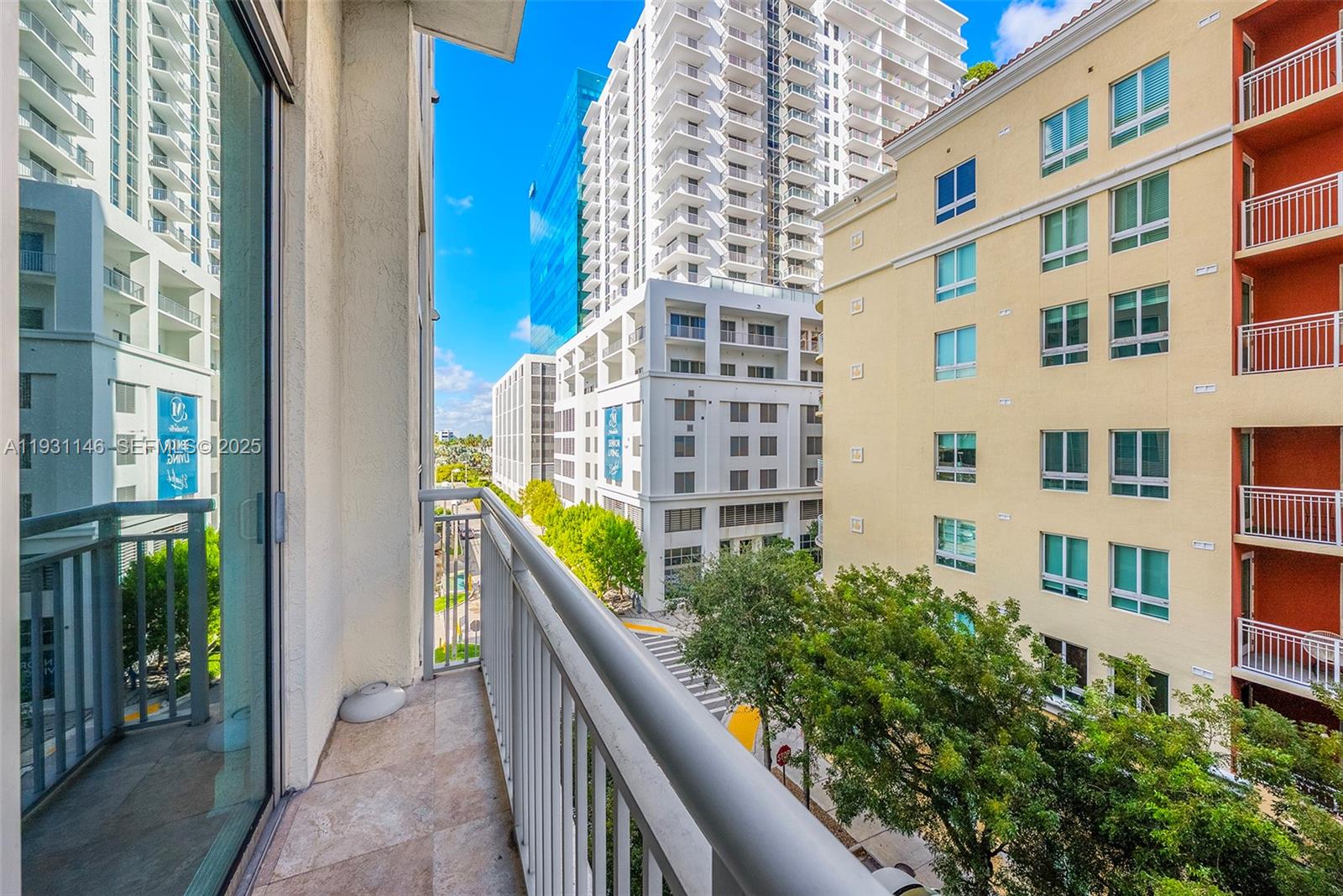 9066 Southwest 73rd Court, Unit 405 Miami, FL 33156 - Photo 22 of 32 a view of a building from a balcony