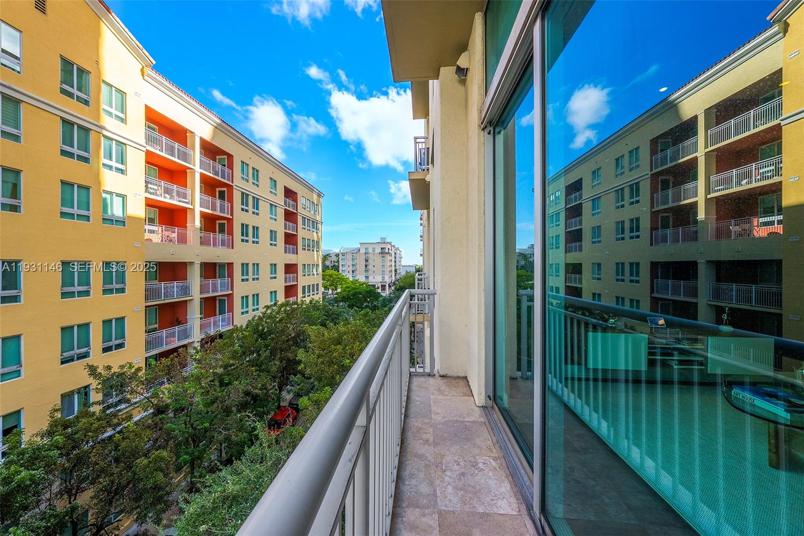 9066 Southwest 73rd Court, Unit 405 Miami, FL 33156 - Photo 23 of 32 a view of building with balcony