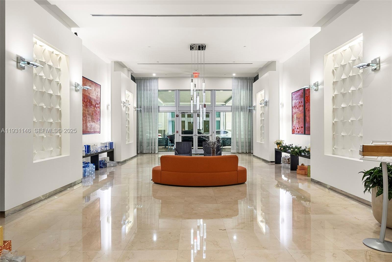9066 Southwest 73rd Court, Unit 405 Miami, FL 33156 - Photo 24 of 32 a living room with fireplace furniture and a large window