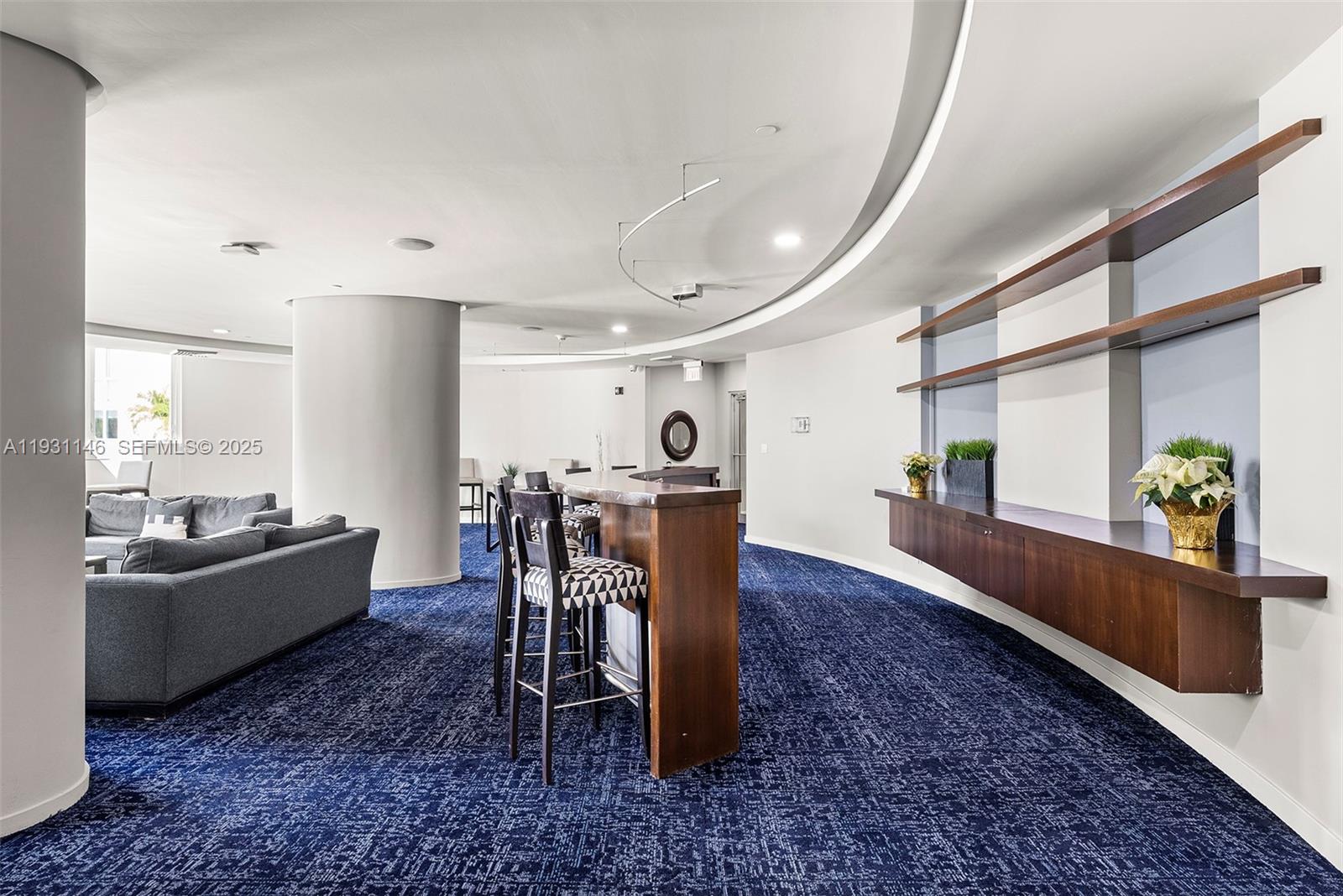 9066 Southwest 73rd Court, Unit 405 Miami, FL 33156 - Photo 28 of 32 a dining room with furniture and wooden floor