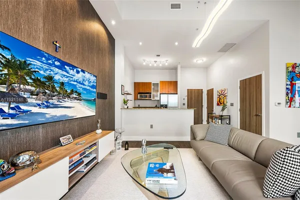 a living room with furniture and a flat screen tv