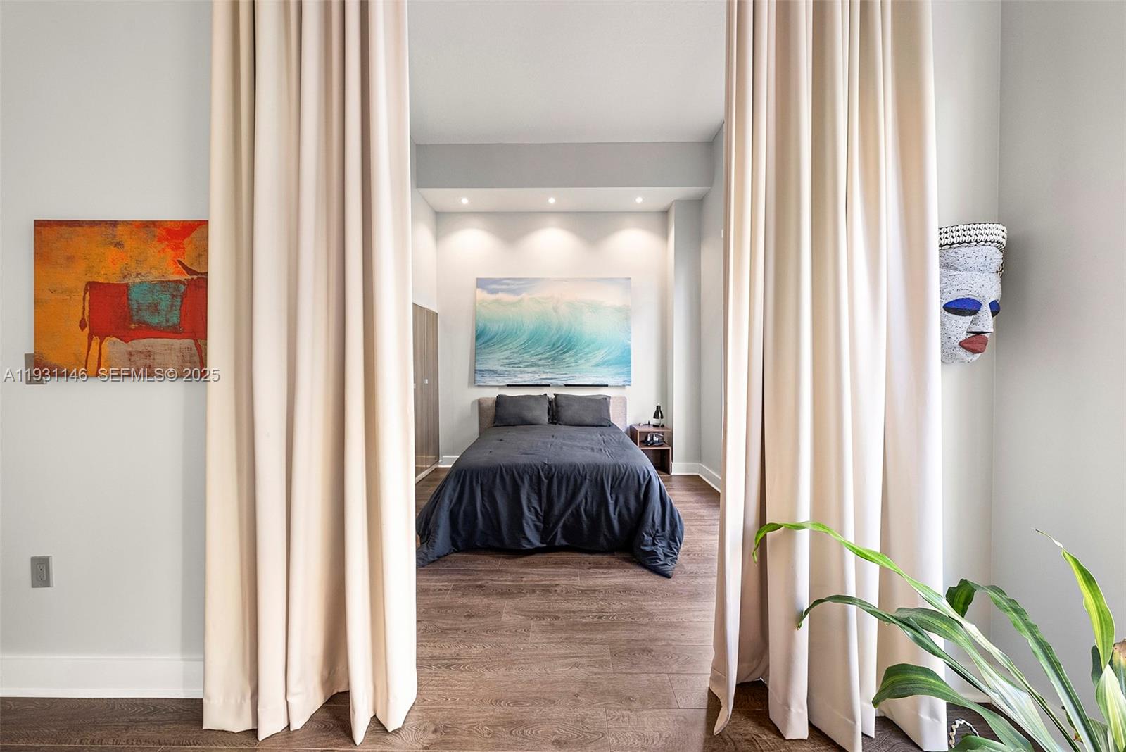 9066 Southwest 73rd Court, Unit 405 Miami, FL 33156 - Photo 9 of 32 a view of a bedroom with a bed and a window