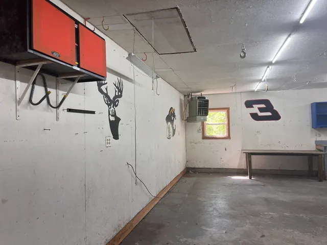 a room with a wooden cabinets and a sink