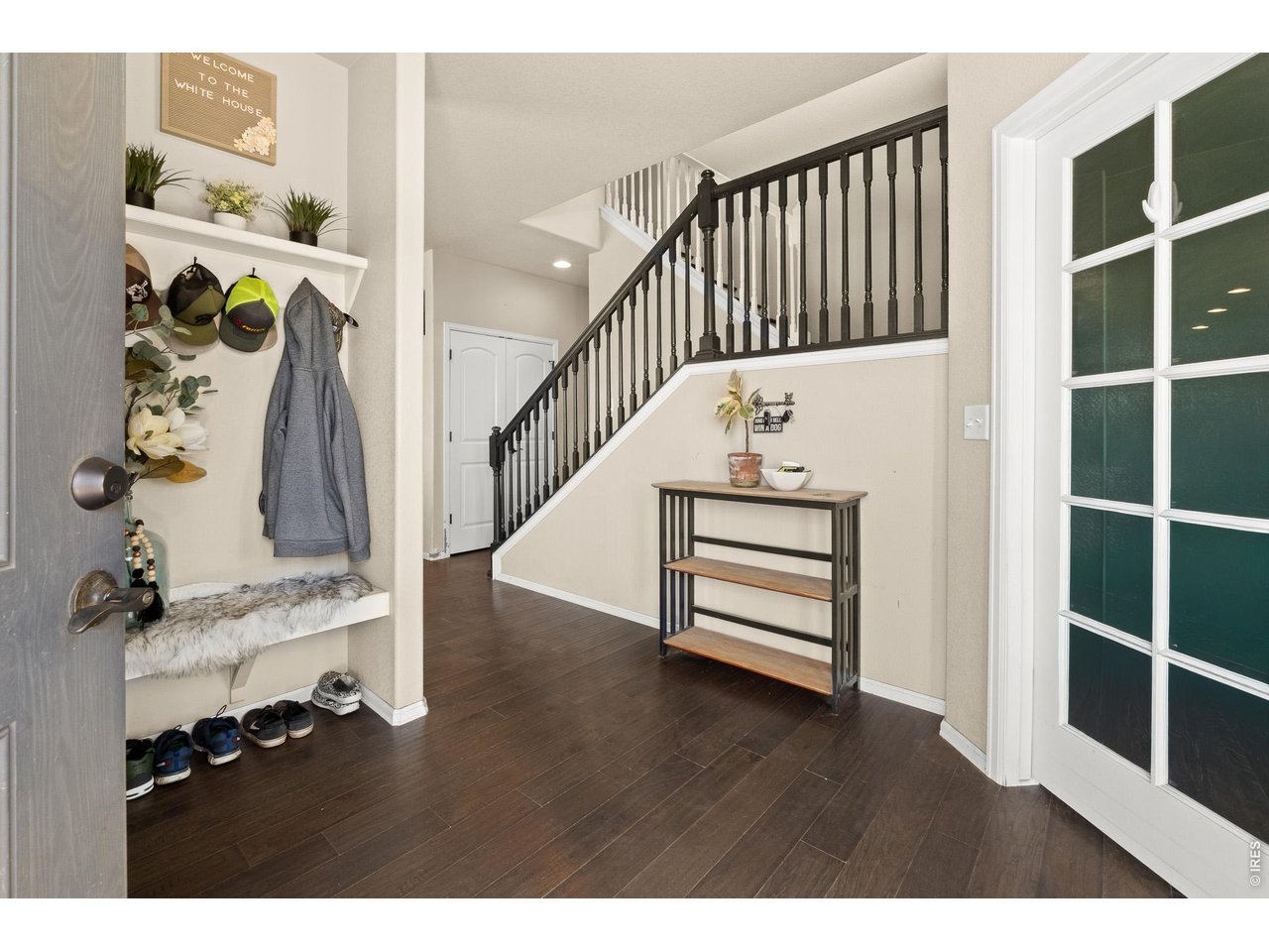 8847 16th St Road Greeley, CO 80634 - Photo 6 of 38 a view of entryway and hall with wooden floor
