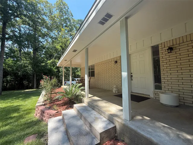 a view of a porch with garden