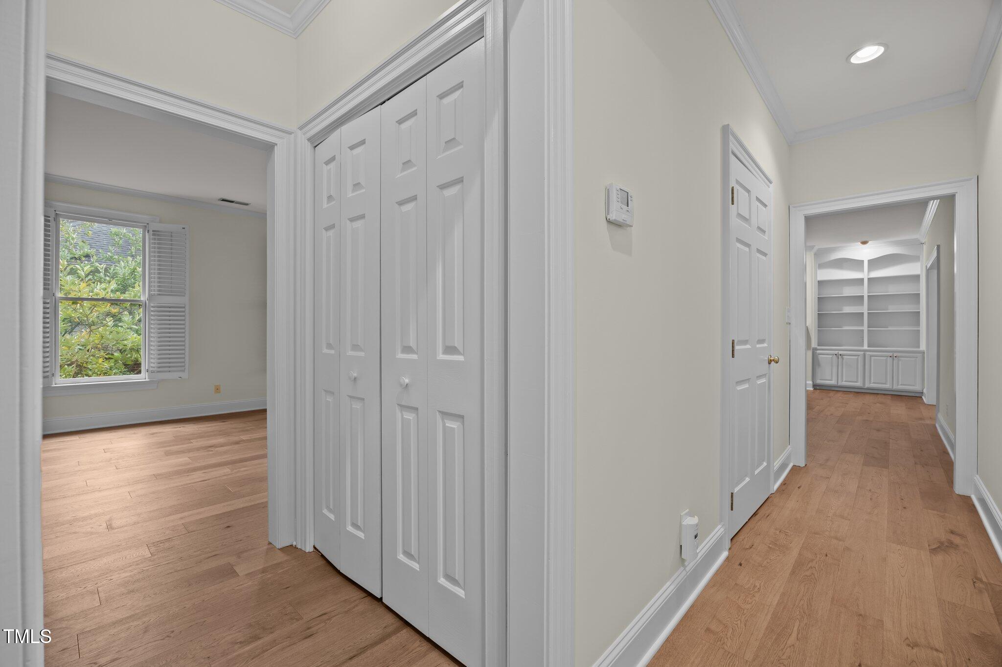 100 Edenburgh Road, Unit 202 Raleigh, NC 27608 - Photo 19 of 52 a view of a hallway with wooden floor and closet area
