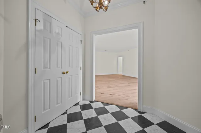 a view of a bathroom with a black and white checkered floor