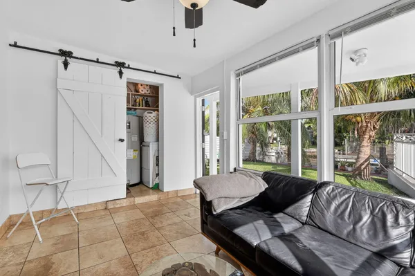 a bedroom with a bed and a television