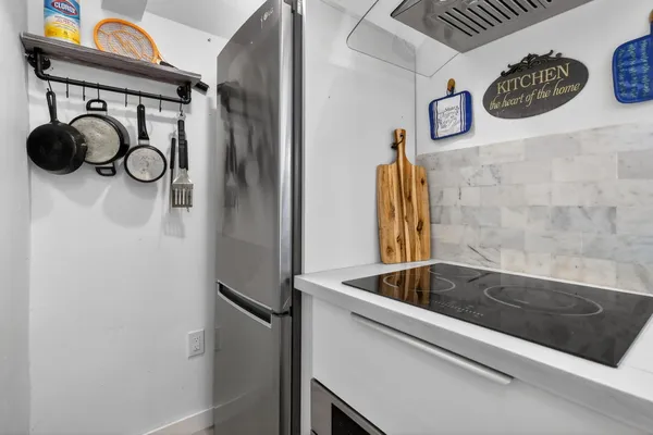 a view of a chairs and table in backyard