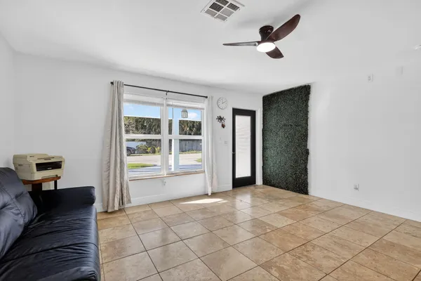 a kitchen with stainless steel appliances a stove a sink a microwave and a refrigerator