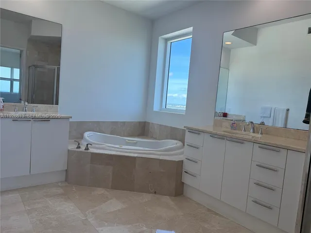 a bathroom with a sink a vanity and mirror