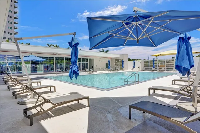 a view of a patio with a table and chairs