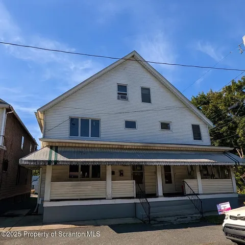a view of a house with a garage