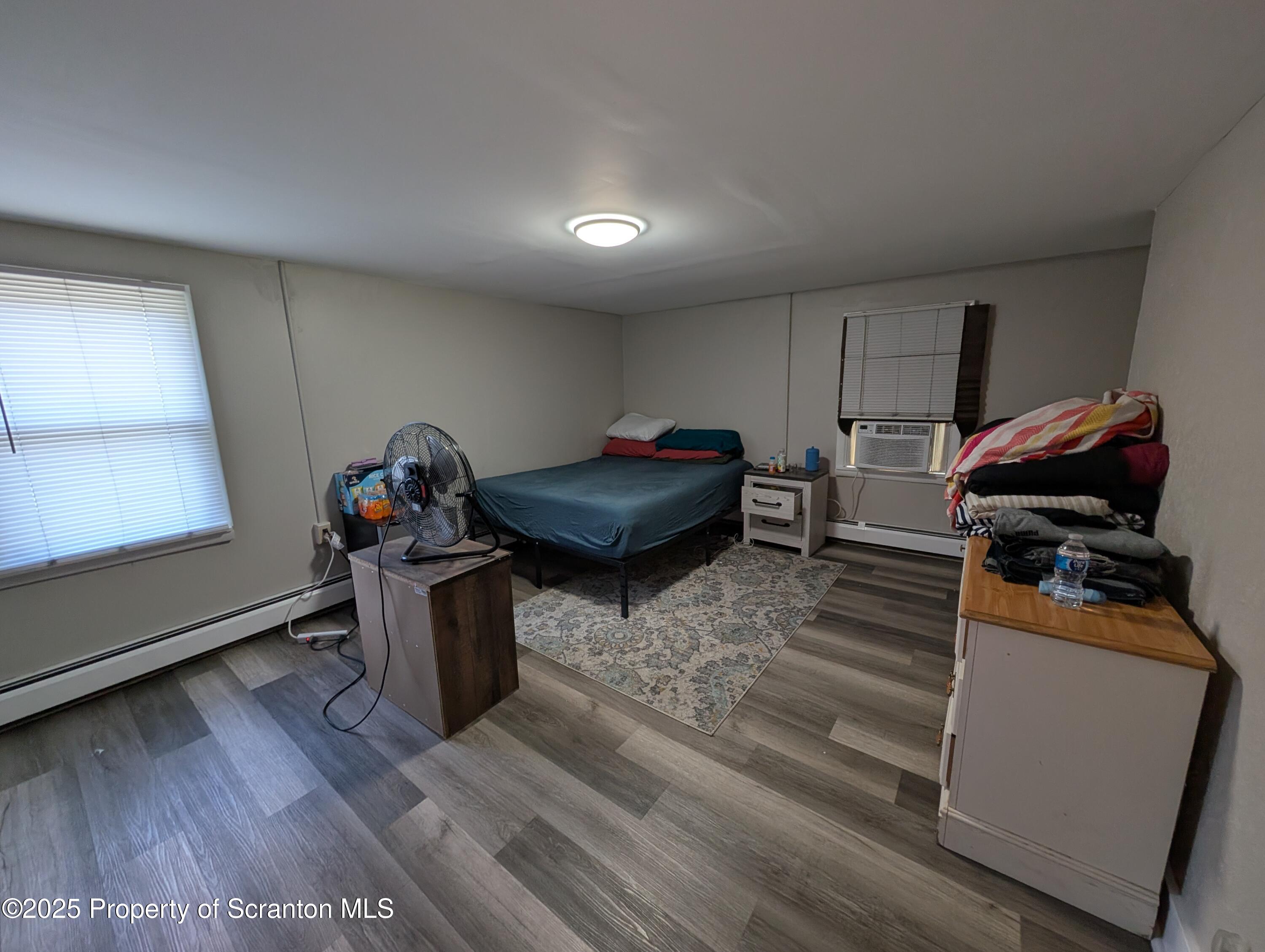 2133-2135 Jackson Street Scranton, PA 18504 - Photo 14 of 38 a room with furniture and a window