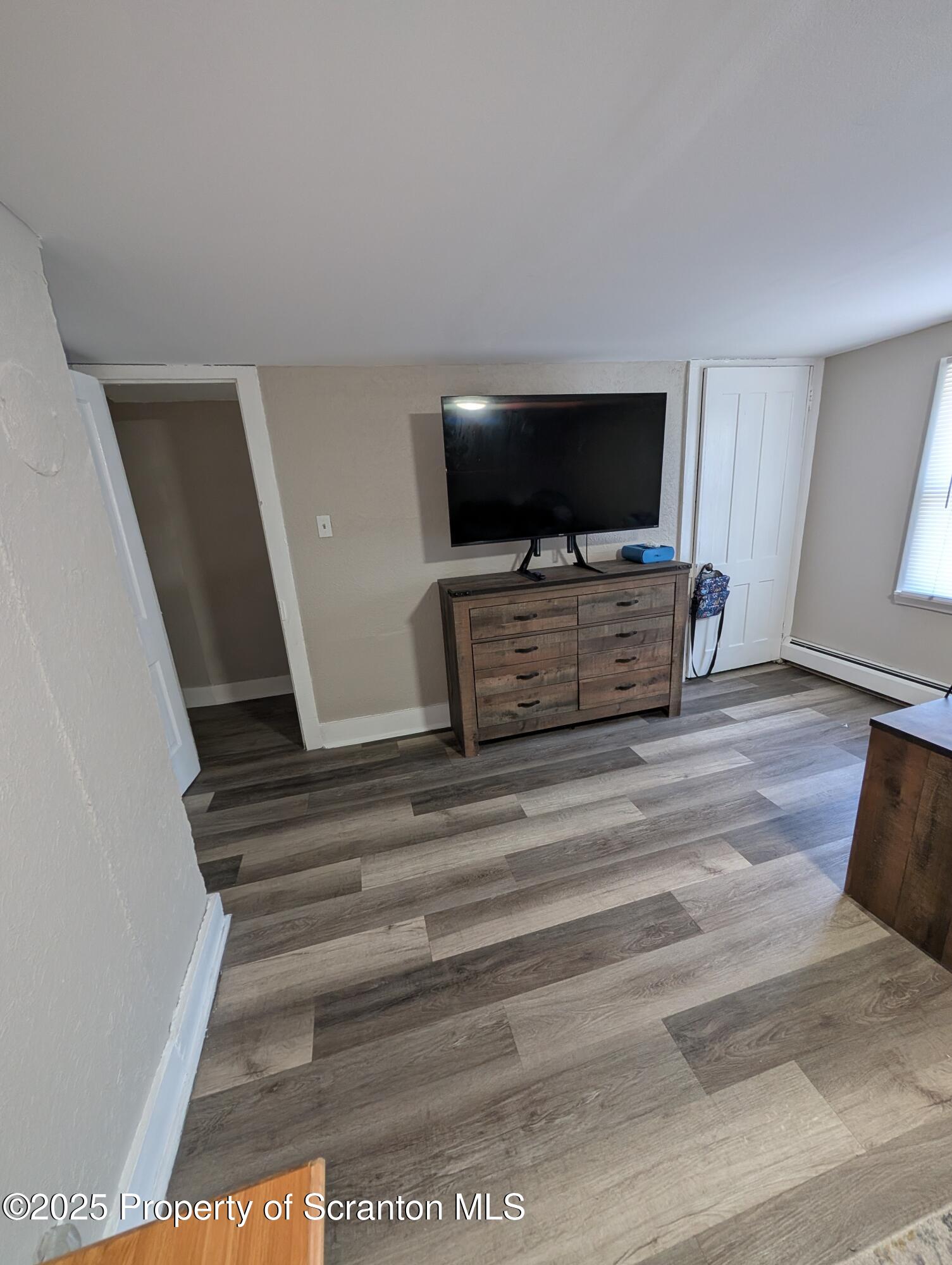 2133-2135 Jackson Street Scranton, PA 18504 - Photo 15 of 38 a living room with furniture and a flat screen tv